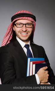 Arab man with book in diversity concept