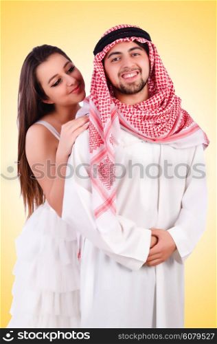 Arab man with his wife on white