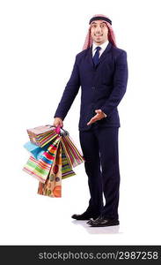 Arab man with shopping gifts on white