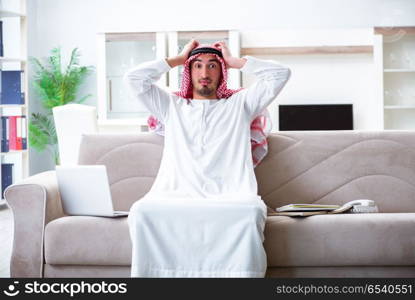 Arab man working at home on his work