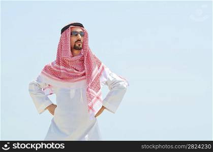 Arab on seaside in traditional clothing