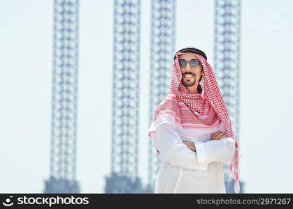 Arab on seaside in traditional clothing