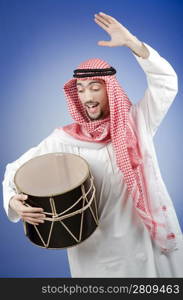 Arab playing drum in studio shooting