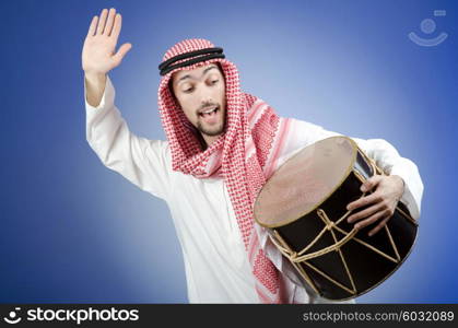 Arab playing drum in studio shooting
