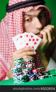 Arab playing in casino - gambling concept with man