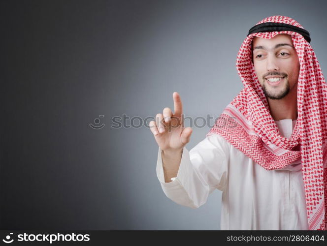 Arab pushing virtual buttons