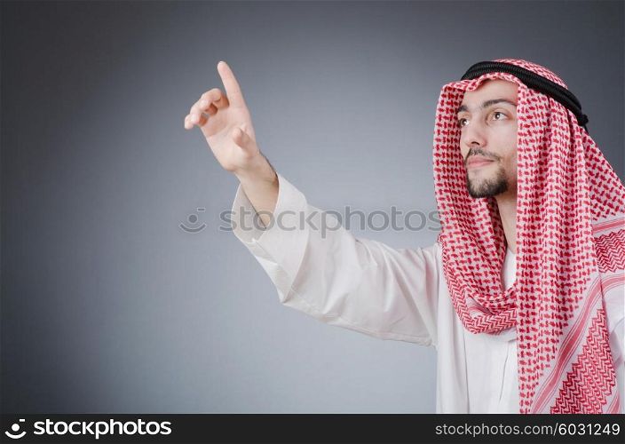 Arab pushing virtual buttons