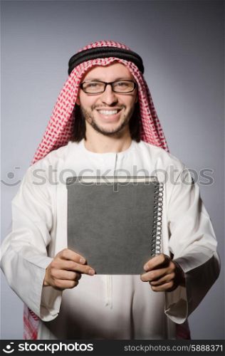 Arab student with book in education concept