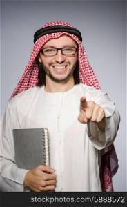 Arab student with book in education concept
