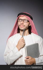 Arab student with book in education concept