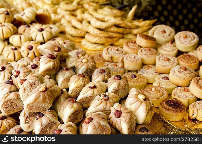 arab sweet pastries cakes stacked bakery with nuts