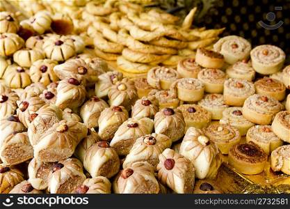 arab sweet pastries cakes stacked bakery with nuts