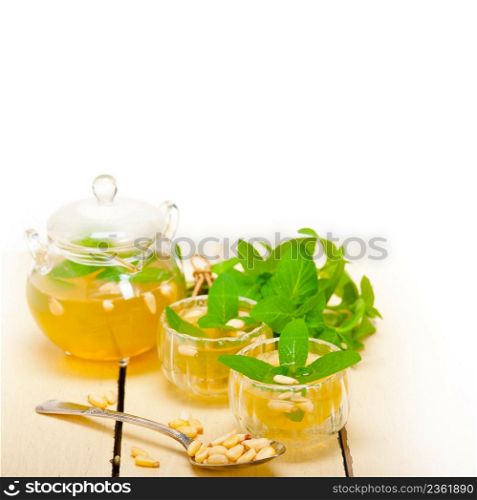 Arab traditional style mint and pine nuts tea called at tay