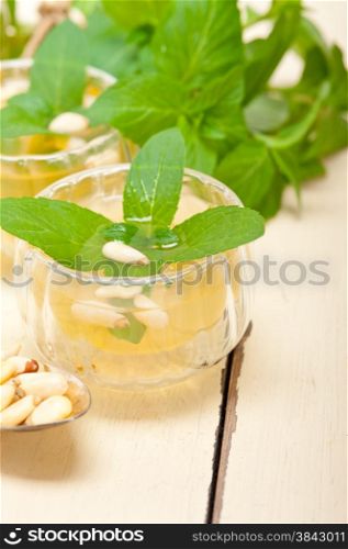 Arab traditional style mint and pine nuts tea called at tay