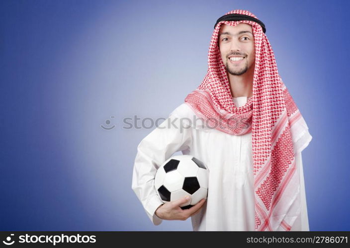 Arab with football in studio shooting