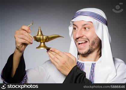 Arab with lamp in studio