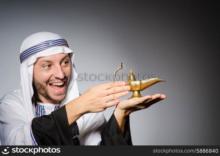 Arab with lamp in studio