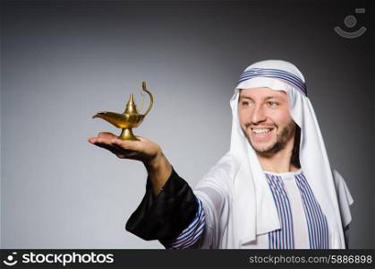 Arab with lamp in studio