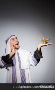 Arab with lamp in studio