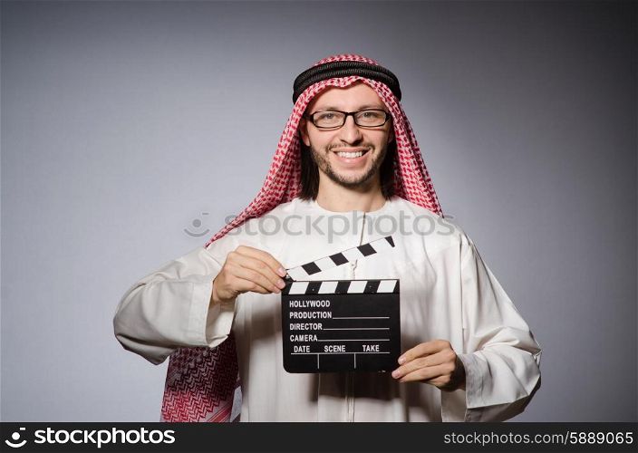 Arab with movie clapper board