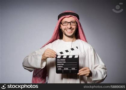Arab with movie clapper board