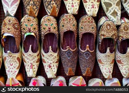 Arabian babouches shoes at market stall closeup
