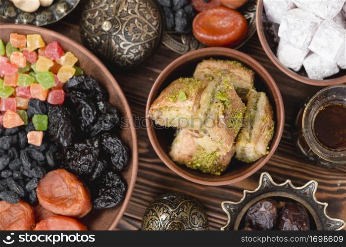 arabian sweets ramadan baklava lukum dried fruits bowl desk