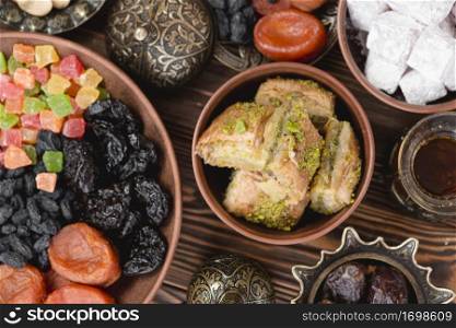 arabian sweets ramadan baklava lukum dried fruits bowl desk