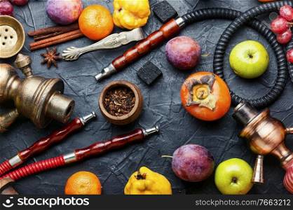 Arabic smoking hookah with apple,pomegranate,citrus and grape aroma.Modern hookah shisha. Fruit tobacco for shisha