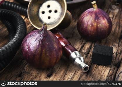 Arabic smoking hookah with figs. Exotic smoked shisha with tobacco with a taste of fig fruit