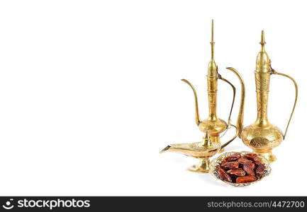 Arabic traditional dishes, pots and dates fruits. Oriental holidays decoration