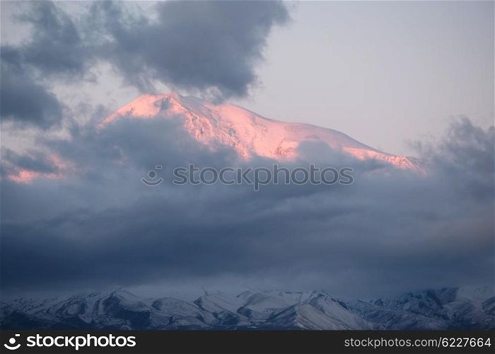Ararat mountain at sunrise covered with clouds