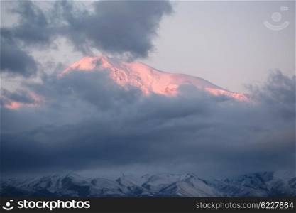Ararat mountain at sunrise covered with clouds