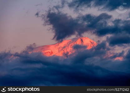 Ararat mountain at sunrise covered with clouds. View on Turkey from Armenia