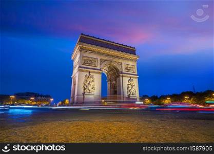 Arc de Triomphe located in Paris, France at twilight