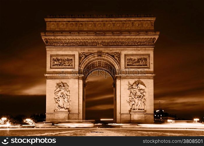 Arc de Triomphe, Paris, France at night. View from Avenue des Champs-Elysees