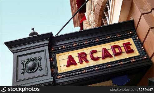 Arcade sign on old movie theatre playbill.