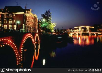 Arch bridge across a canal, Amsterdam, Netherlands