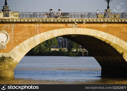 Arch bridge across a river, Pont De Pierre, Garonne River, Bordeaux, Aquitaine, France