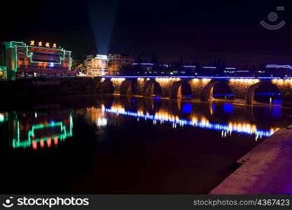 Arch bridge lit up at night, Tunxi District, Huangshan, Anhui Province, China