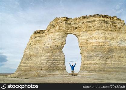 arch in Monument Rocks (Chalk Pyramids) in western Kansas with a human figure added for a scale