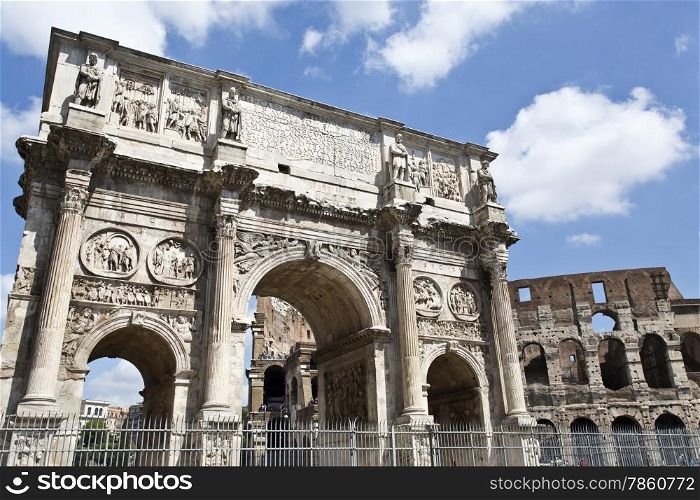 Arch of Constantine and colosseum or coliseum in background at Rome, Italy
