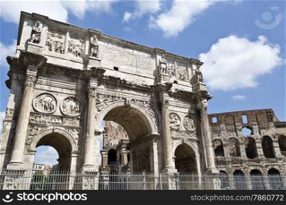 Arch of Constantine and colosseum or coliseum in background at Rome, Italy