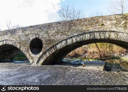 Arch of old Cenarth Bridge, Newcastle Emlyn, Carmarthenshire, Wales, UK