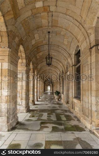 Arch pathway at the Palacio de Raxoi, Santiago de Compostela, Spain. Barrel vault architecture detail. Neoclasic building of century XVIII
