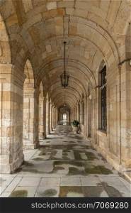 Arch pathway at the Palacio de Raxoi, Santiago de Compostela, Spain. Barrel vault architecture detail. Neoclasic building of century XVIII