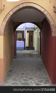 Arch way of a building in Venice, Burano, Italy
