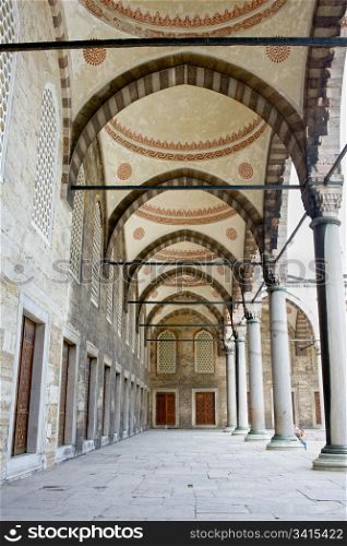 Arched courtyard corridor of the Blue Mosque ( Turkish: Sultan Ahmet Camii) in Istanbul, Turkey