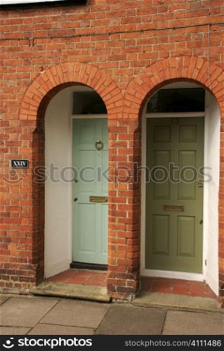 Arched doorways and brick building exterior