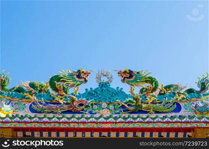 arched entrance of Chinese shrine dragon statue
